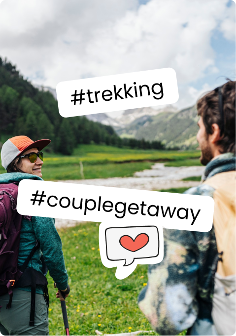 Couple hiking with backpacks in a green mountain valley, hashtags #trekking and #couplegetaway overlay
