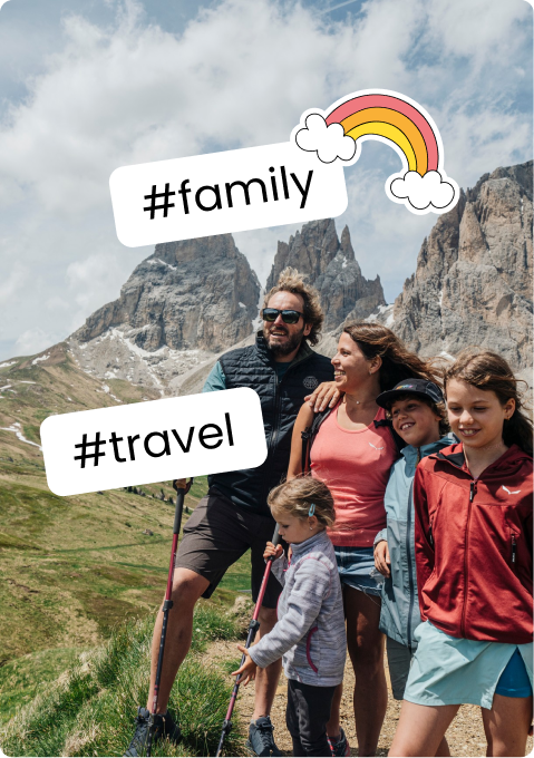 Family of five hiking on a mountain trail with rocky peaks; stickers '#family' and '#travel'.
